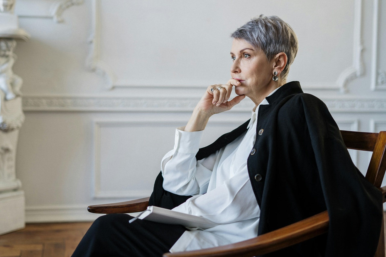 A leader reflecting quietly at a desk